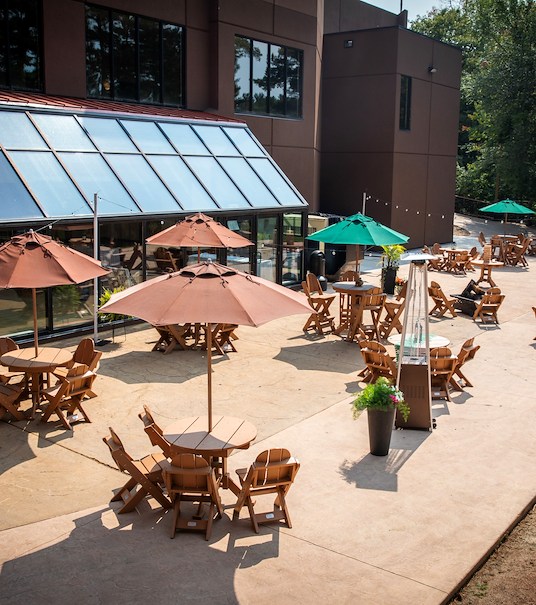 Outdoor patio with tables and umbrellas, Chula Vista Resort, Wisconsin Dells, Wisconsin