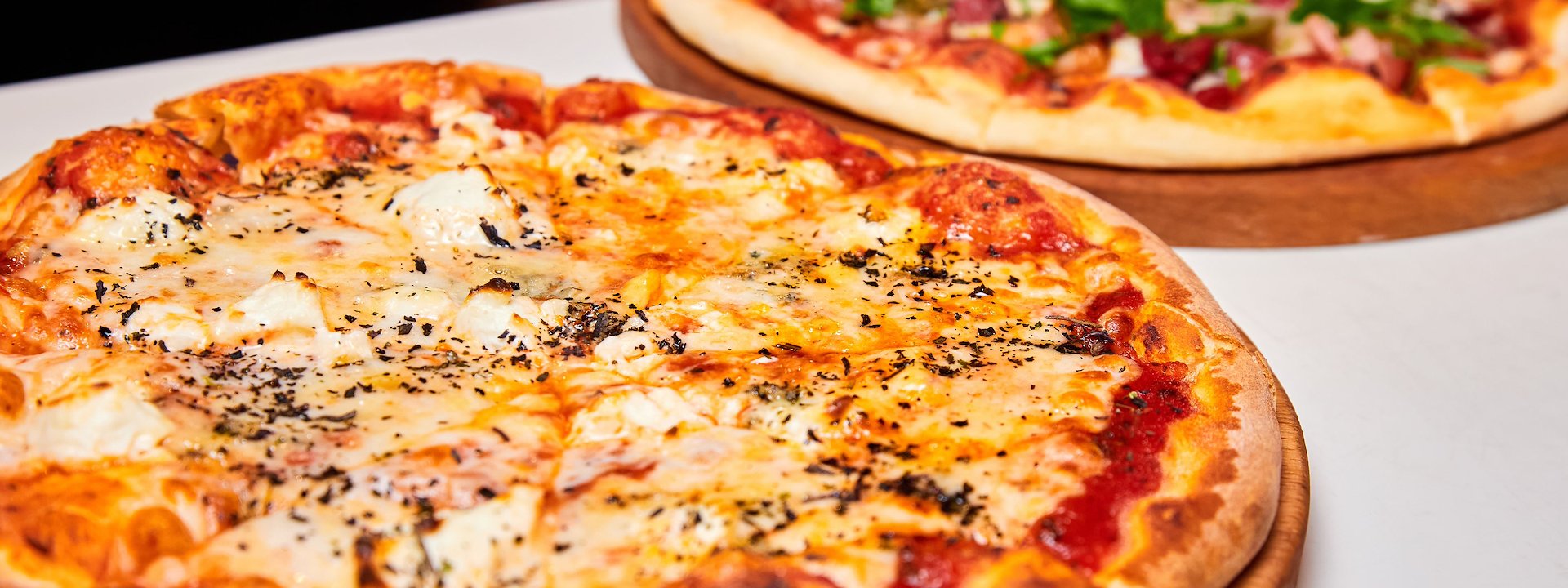 Freshly baked pizza served at Luigi's Pizza.
