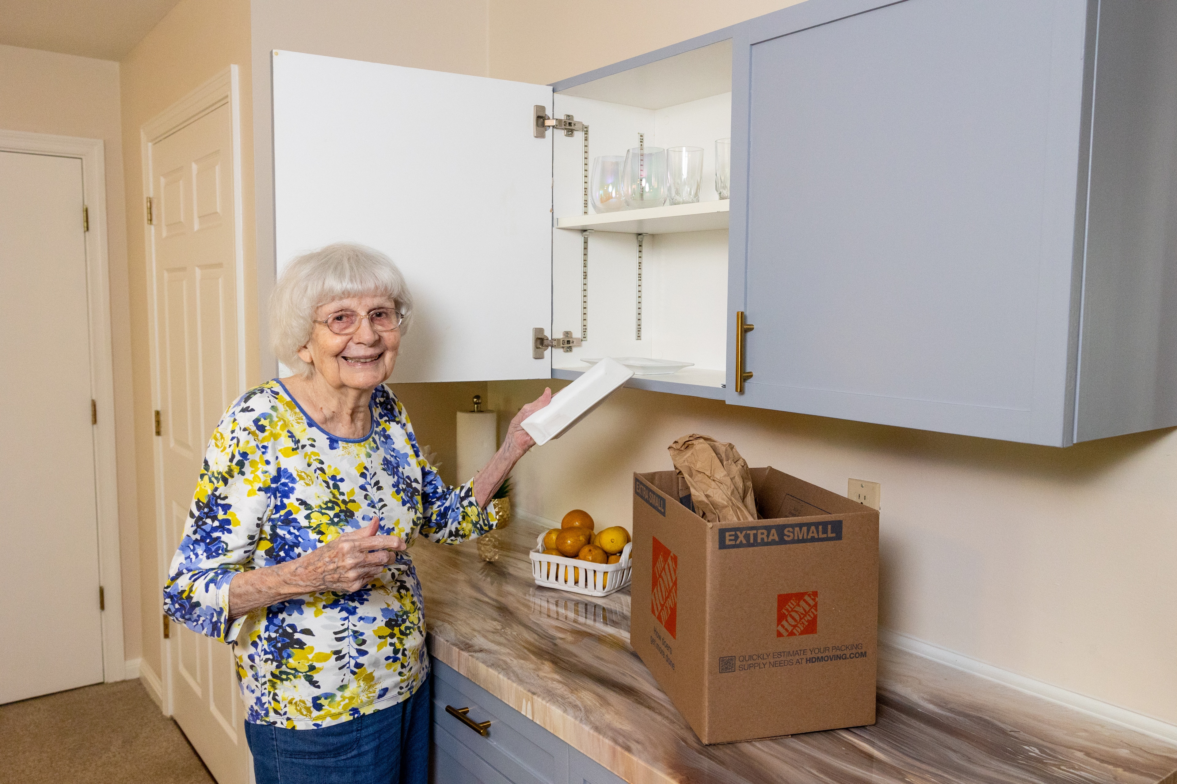 A woman moving into her apartment
