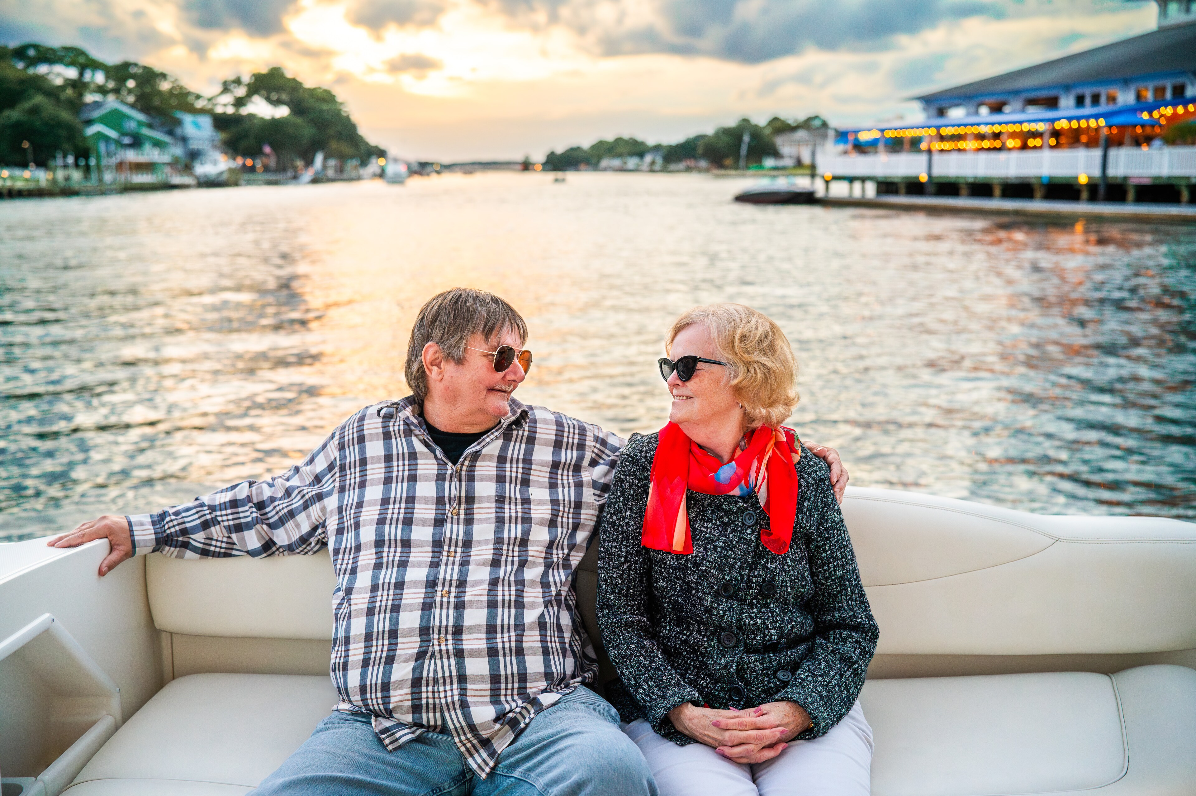 A man and woman sitting on a boat