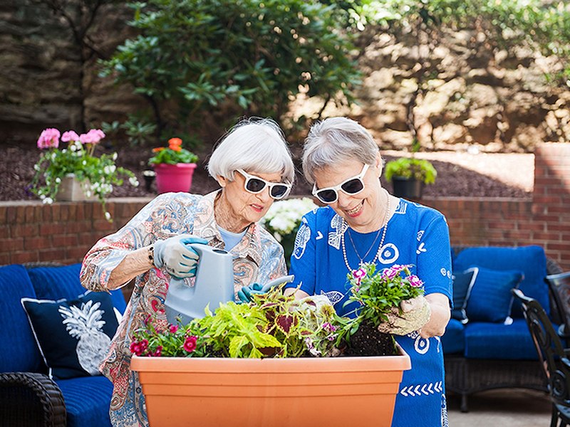 Two women gardening together at Commonwealth Senior Living Stratford House