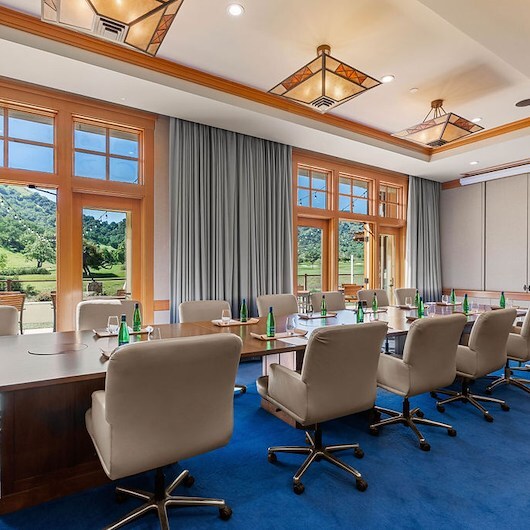 A conference room with a table and chairs