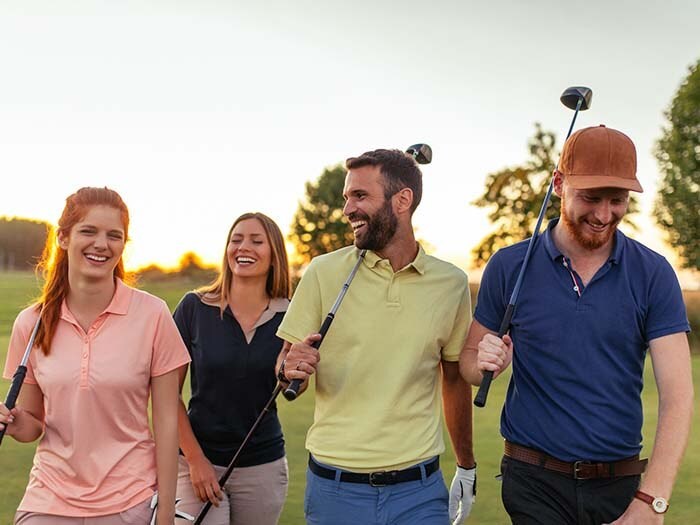 Men and women play golf at Cordevalle USA