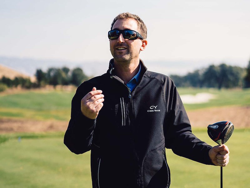 A man holding a golf club