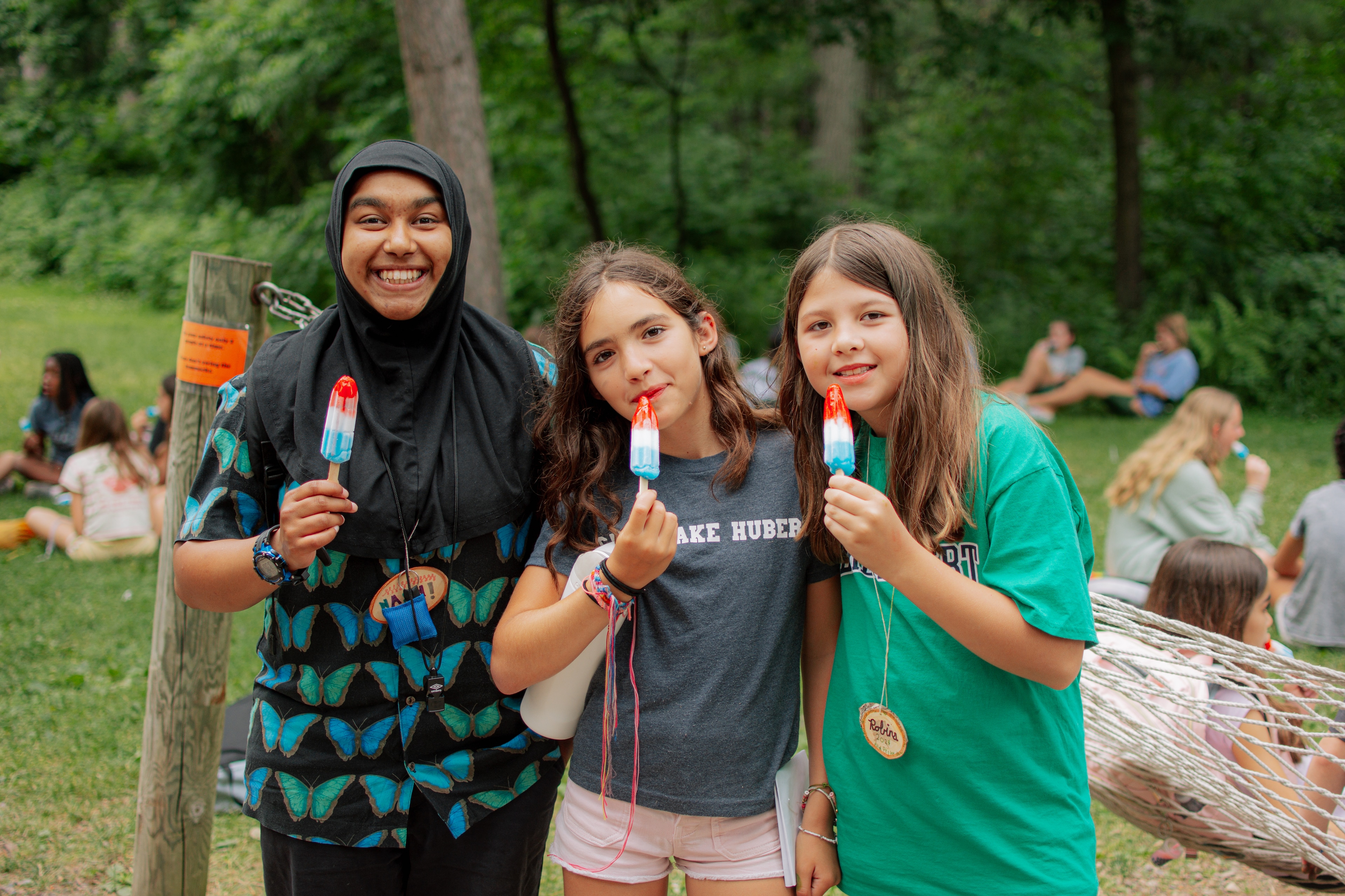 A group of girls holding popsicles
