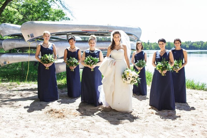 A group of women in blue dresses