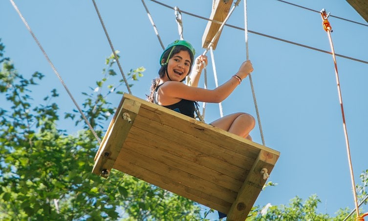 A girl in a rope park
