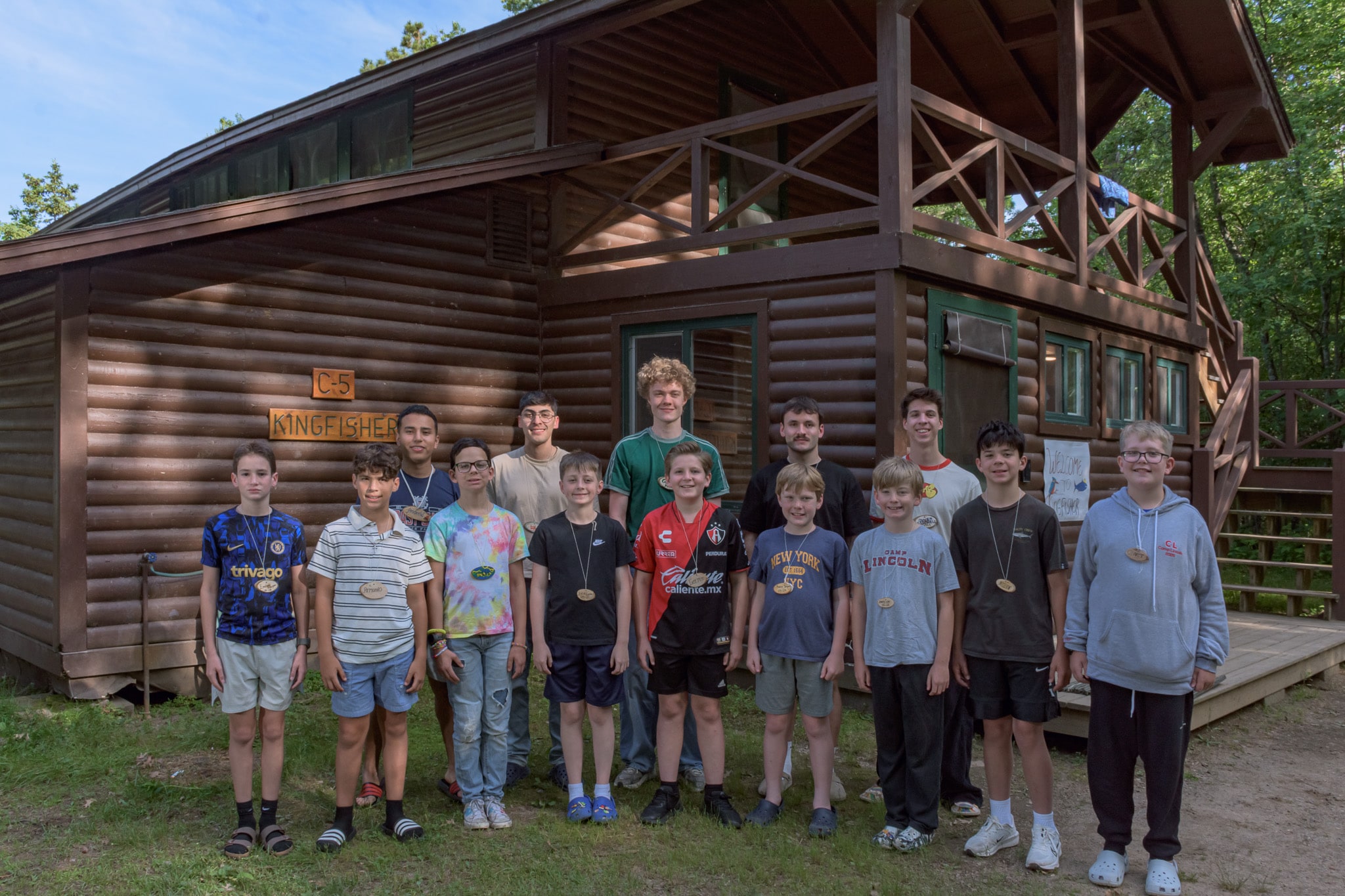 Campers in front of cabin