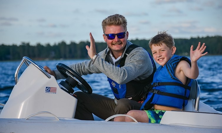 Staff and Camper in Boat preparing for Tubing