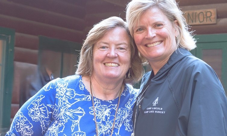 Two women smiling at the camera
