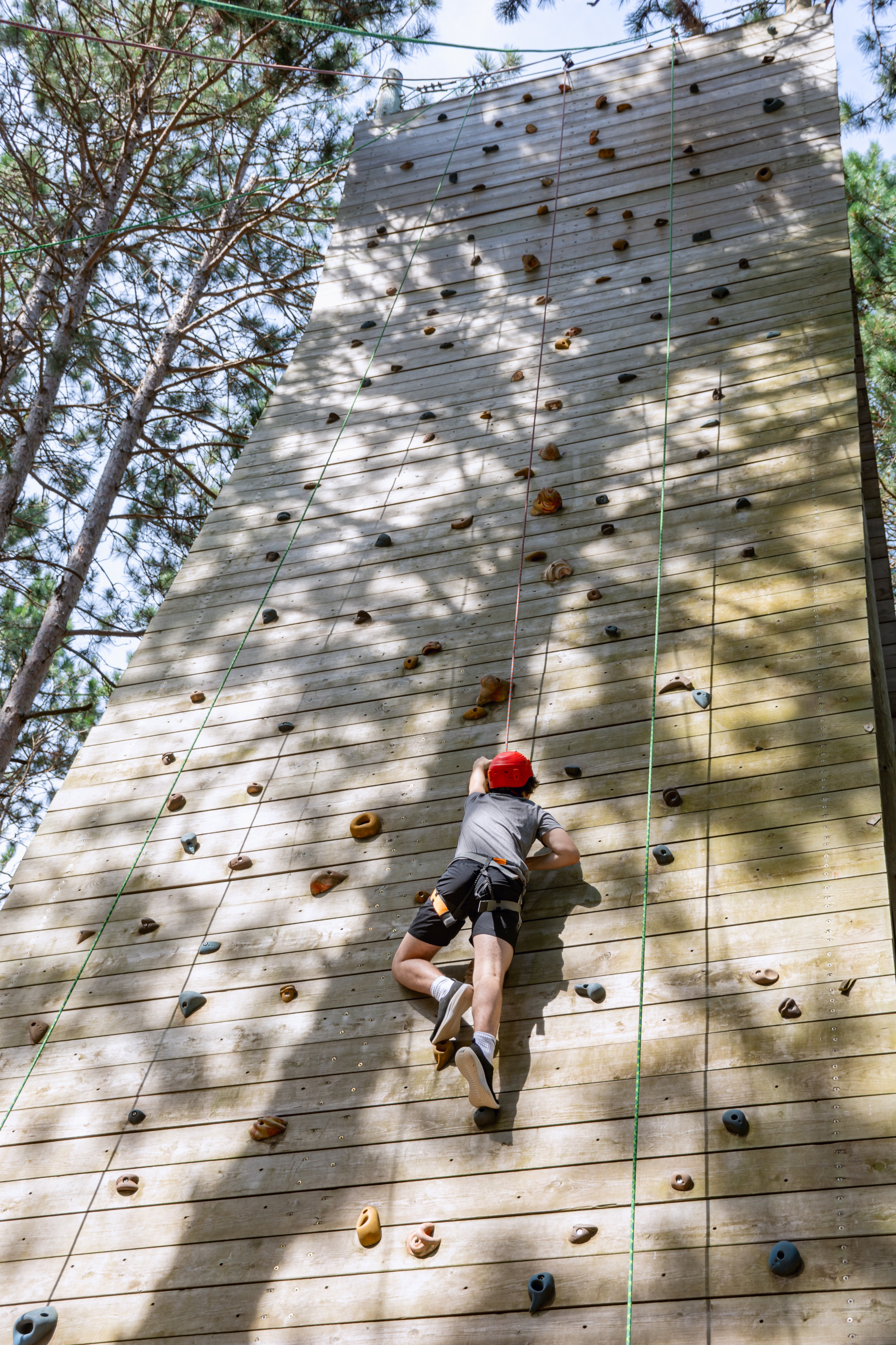 Camp Lincoln camper climbing on climbing wall