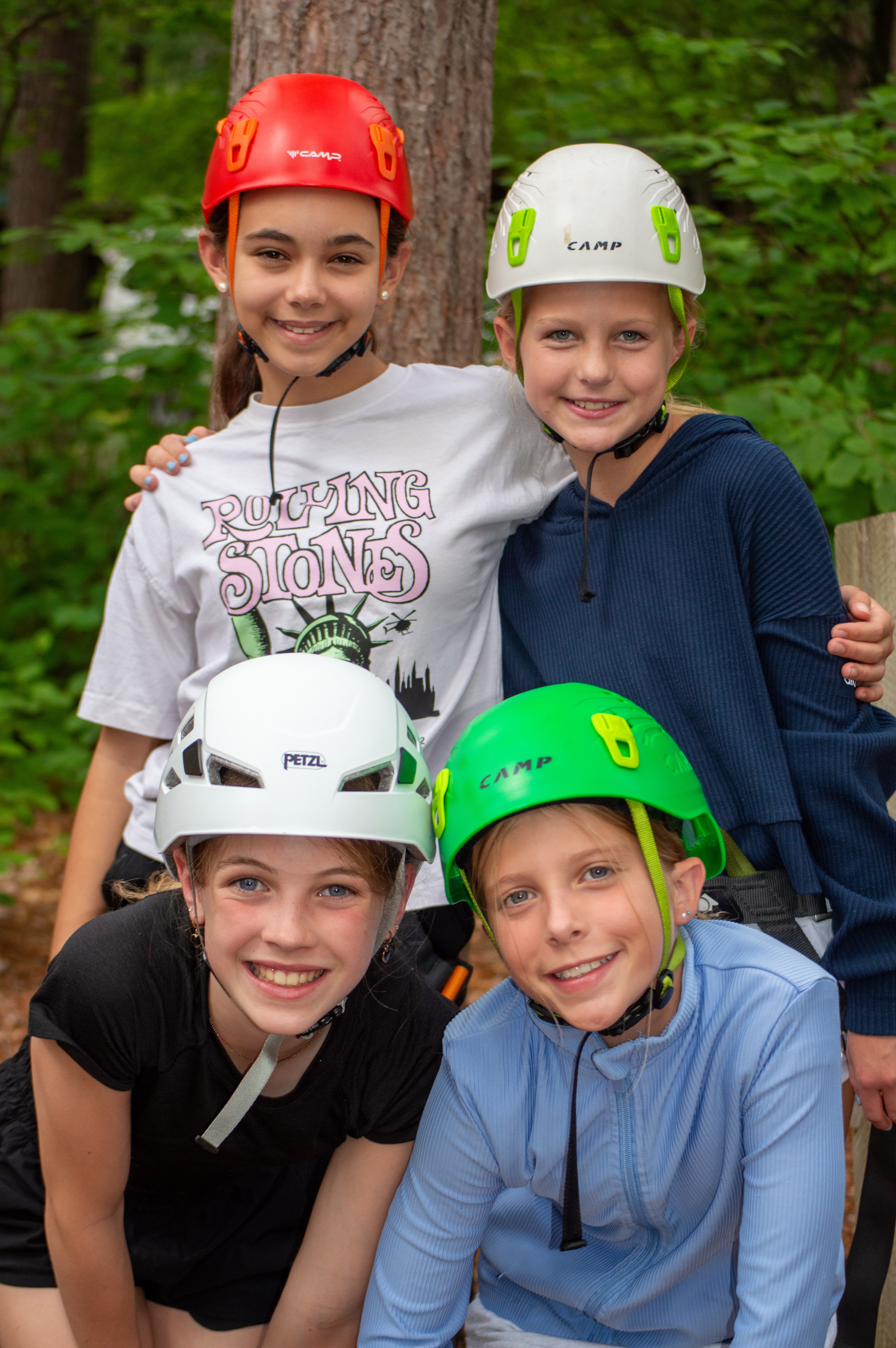 Campers together at climbing wall