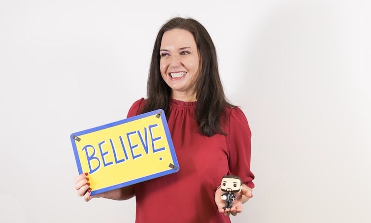 Regina CFO believe sign and a toy figurine
