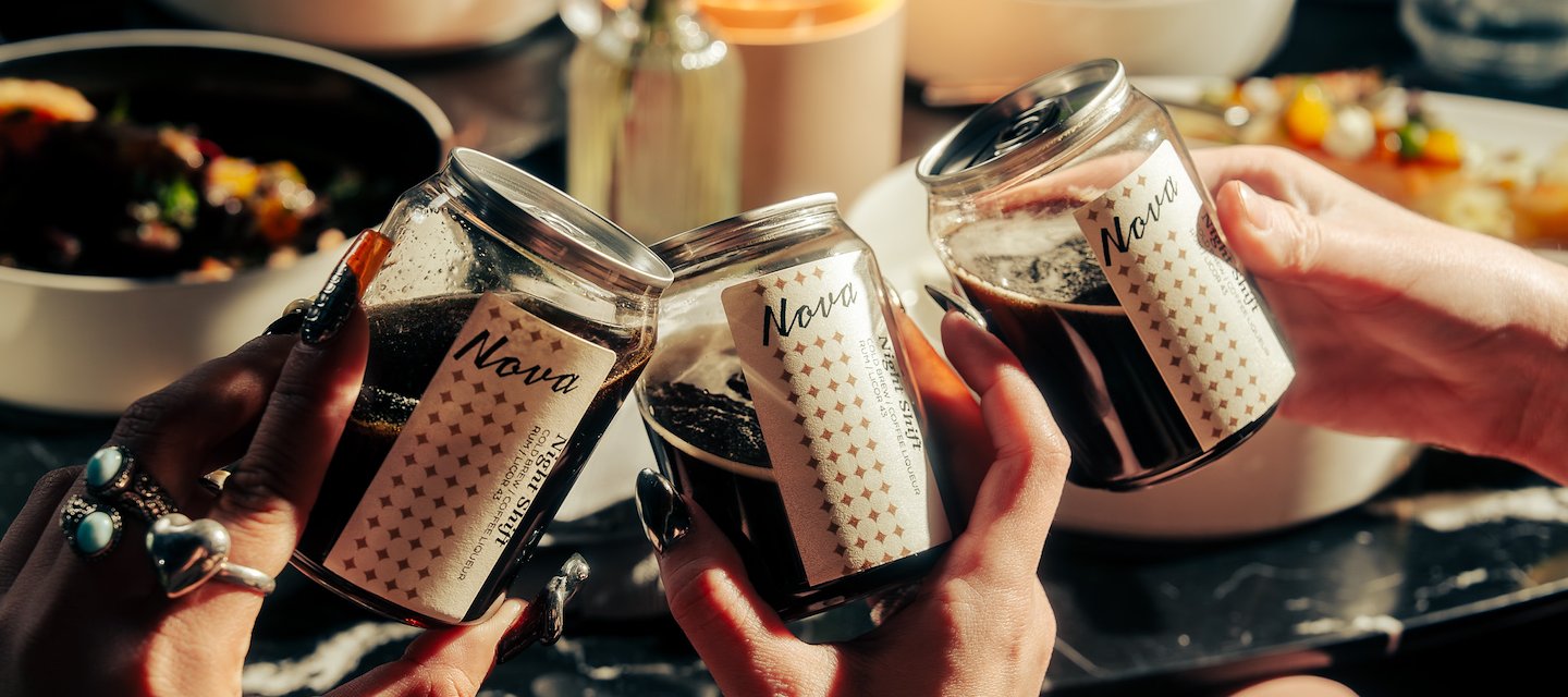 A group of people holding up jars of coffee, Nova Lounge at Vast, Oklahoma