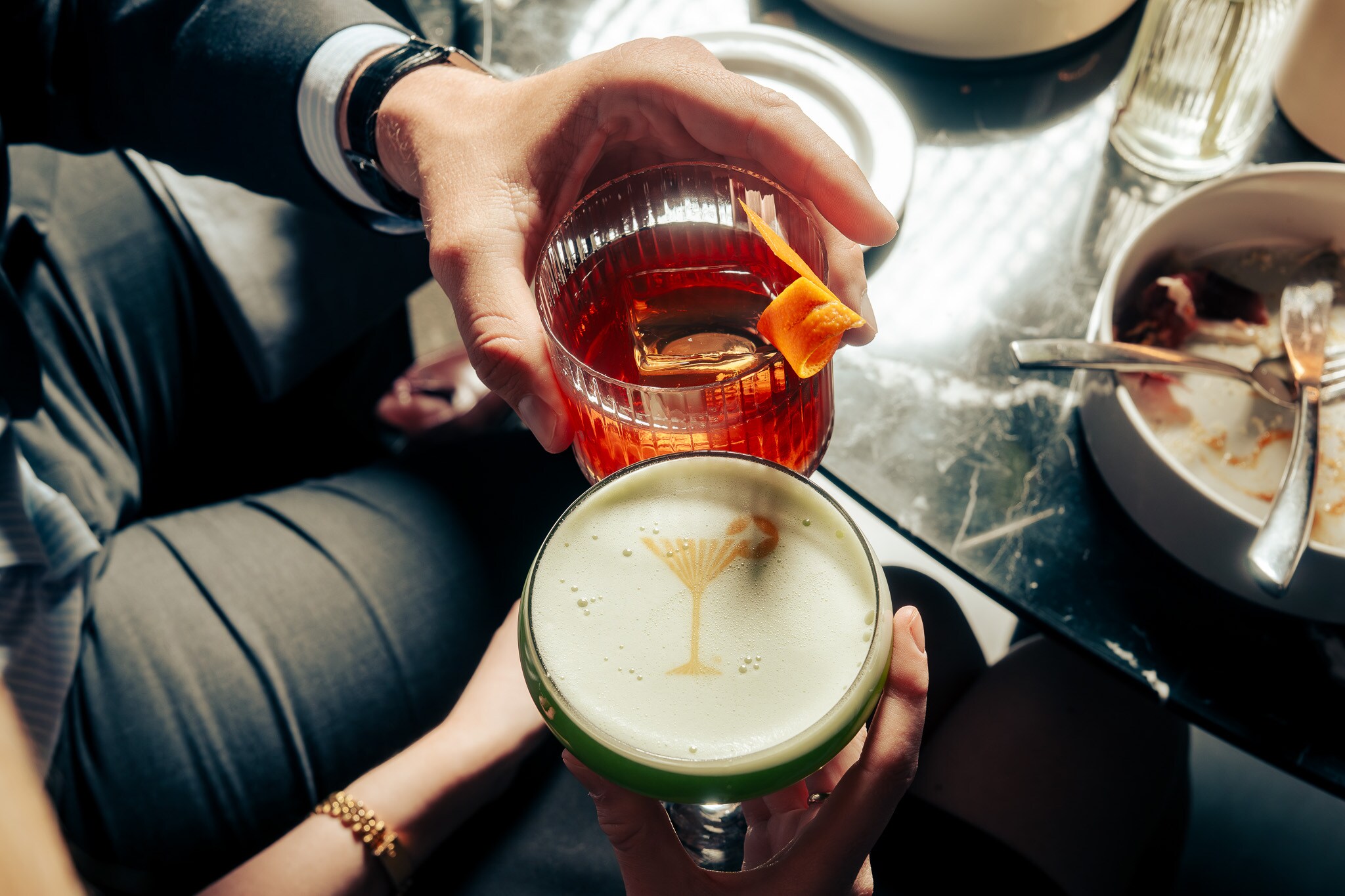 A man and woman are holding drinks at a table, Nova Lounge at Vast, Oklahoma