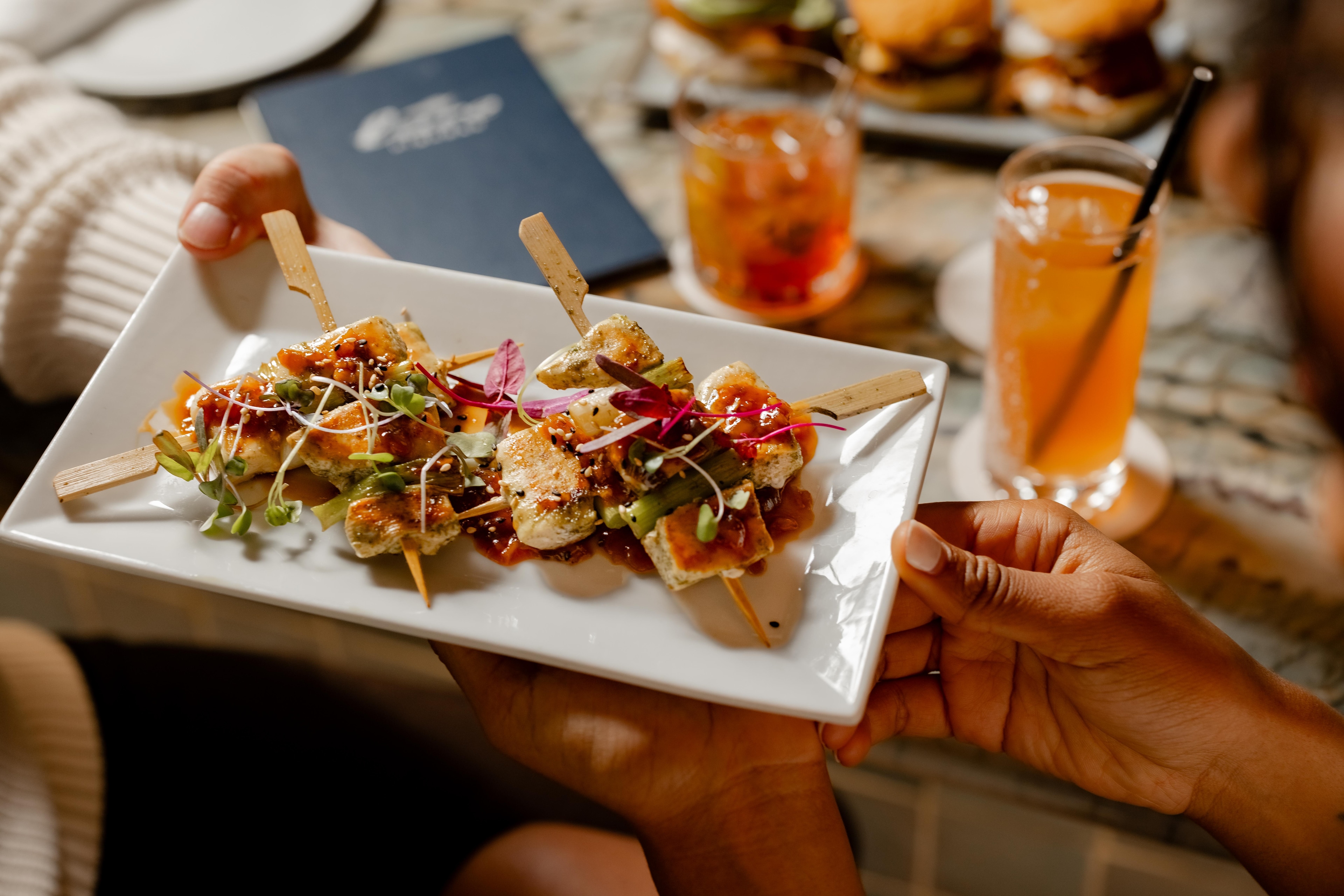 Gourmet skewers topped with vegetables and microgreens