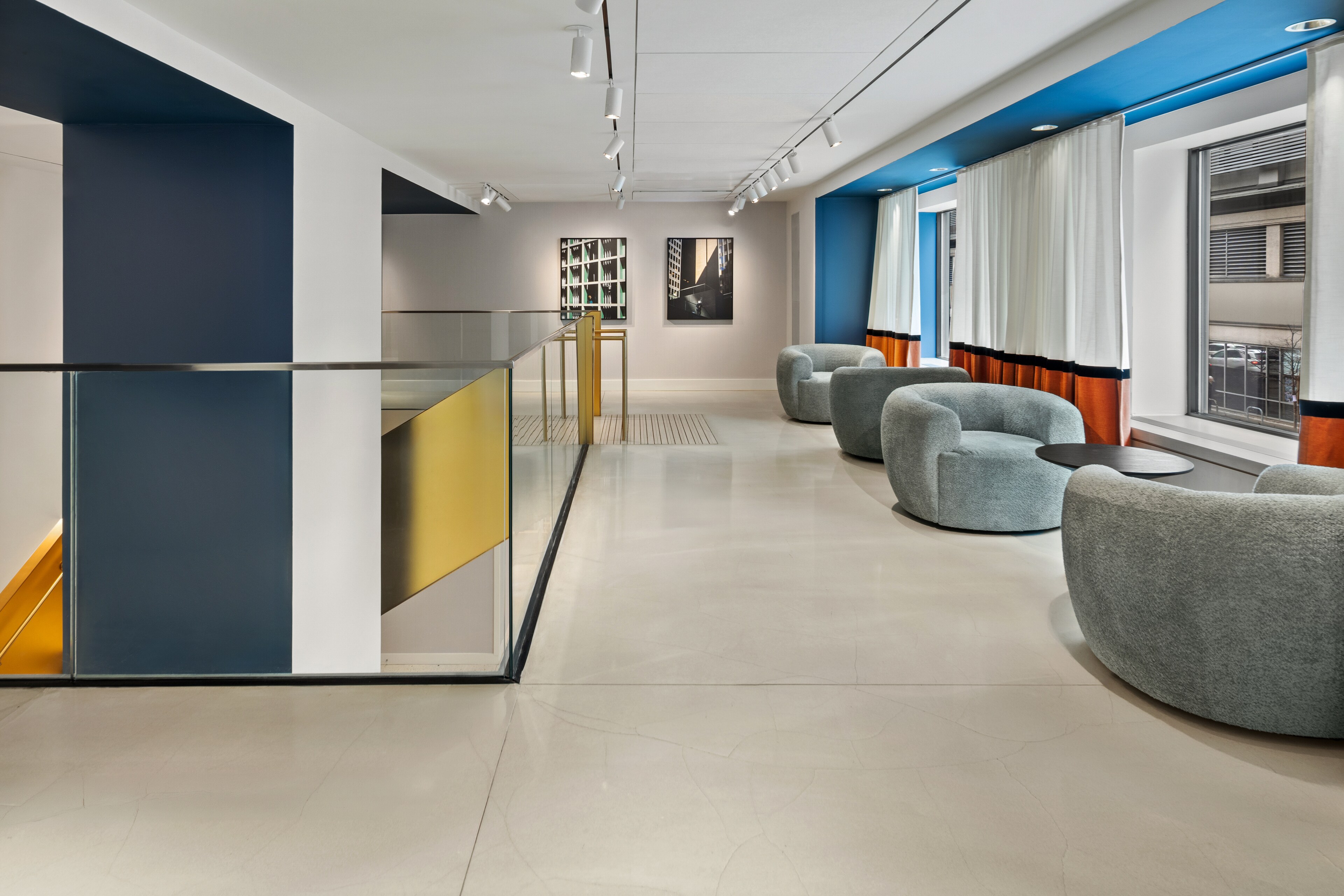 Modern art gallery lounge with blue-and-white walls at The Rivvy Hotel in Ontario Street, Chicago, Illinois