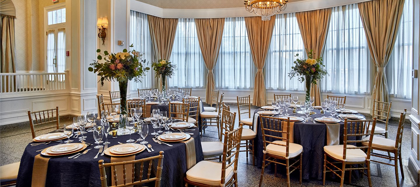 A fancy banquet room with blue tablecloths and gold chairs, Hotel 24 South, Staunton, Virginia