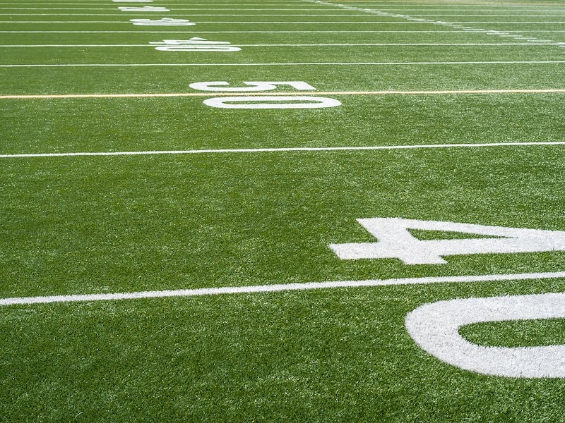 football field close up at the 50 yard line