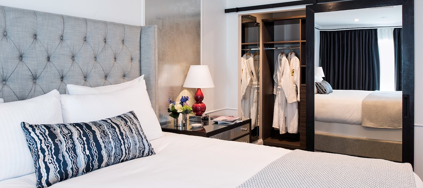 Clare Suite at Phoenix Park Hotel featuring a side view of the luxurious bed and bedside tables