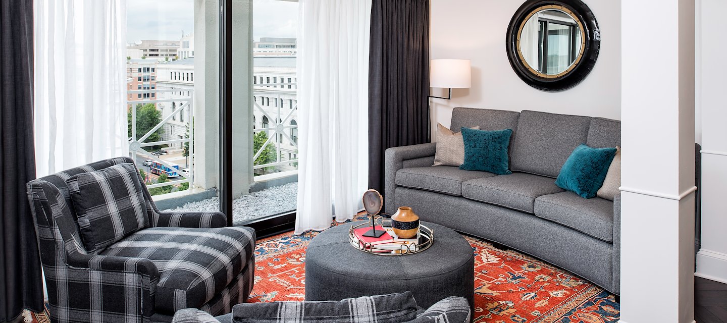 Bi-level suite at Phoenix Park Hotel featuring a spacious living area with a comfortable sofa