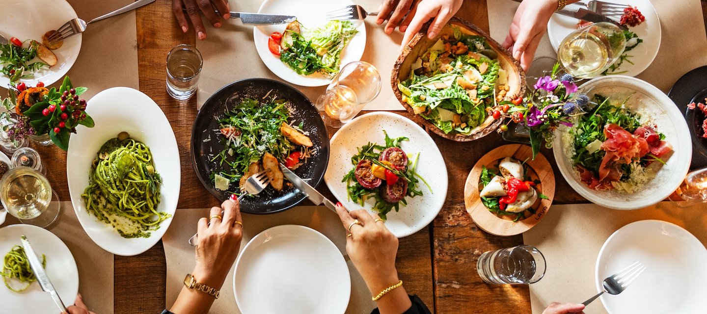 A group of colleagues and friends gathering at Oak and Laurel to eat together