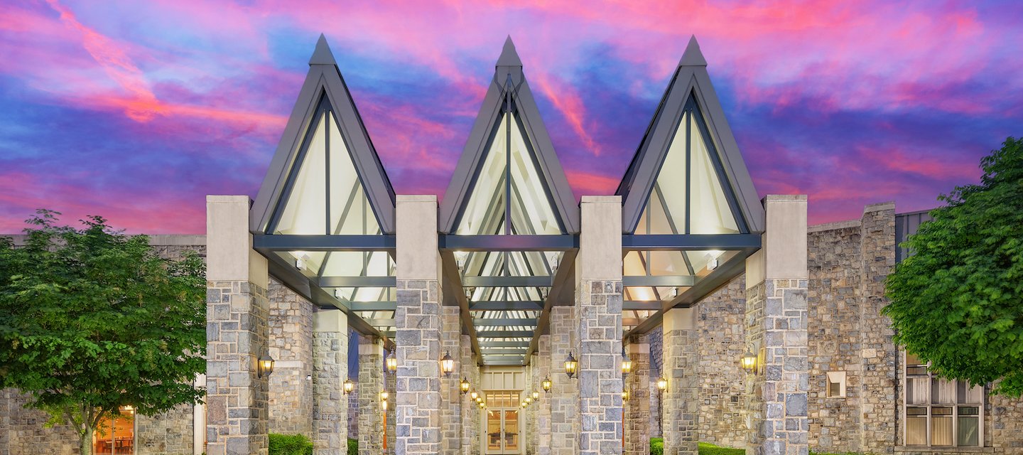 The Inn at Virginia Tech entrance amongst a bright sunset