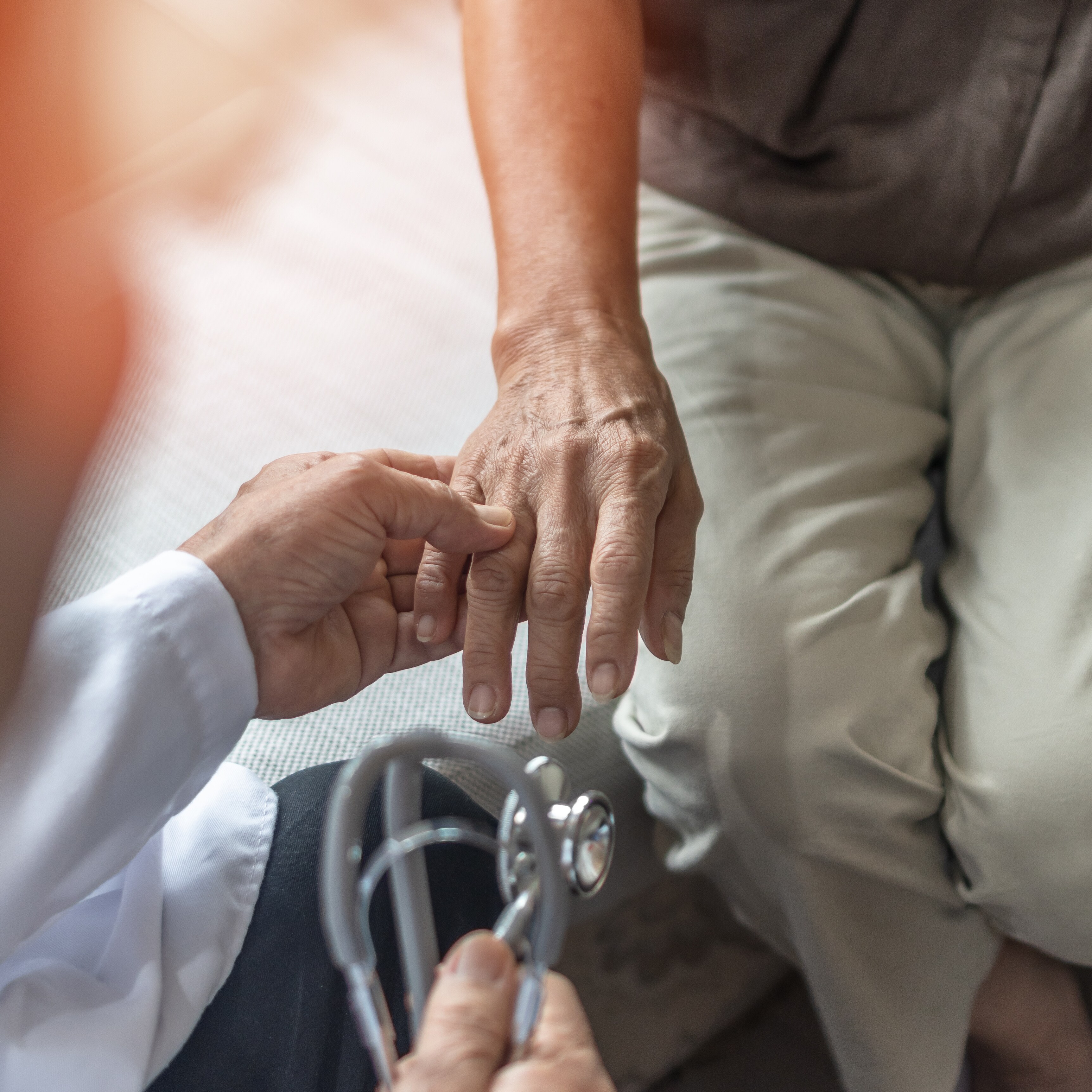 A doctor examines a patient's hand at Brij Medical Centre in Kavi Nagar.