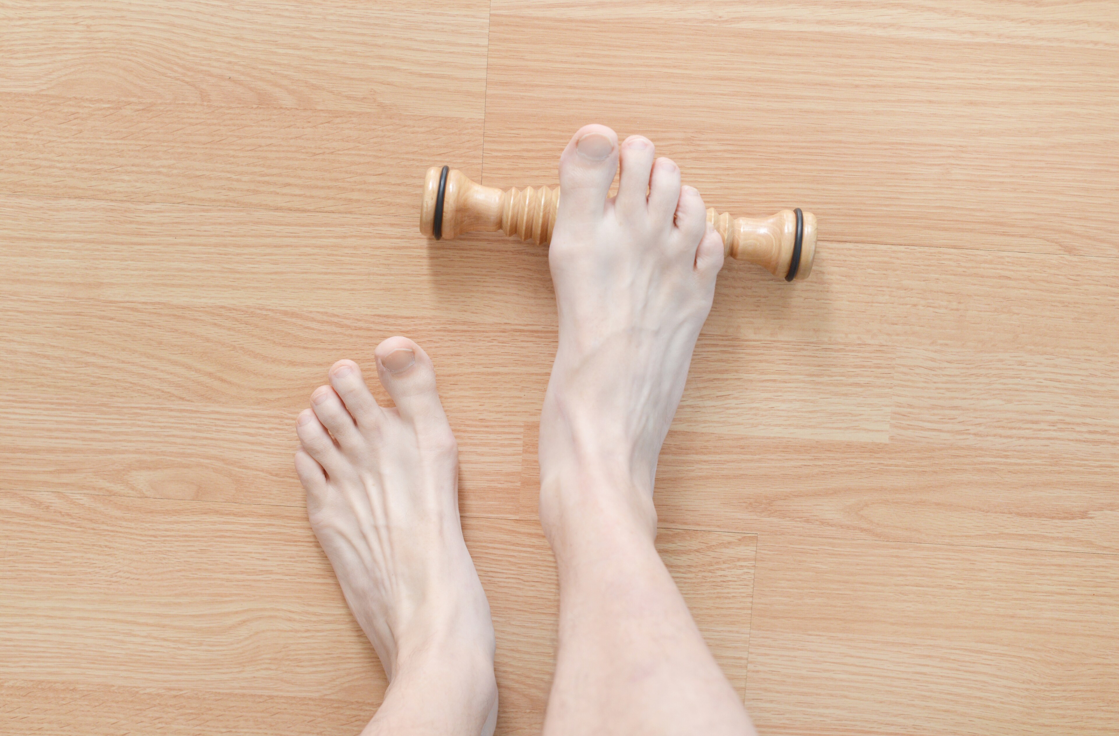 A foot exercises with a massage roller at Brij Medical Centre, Kavi Nagar.