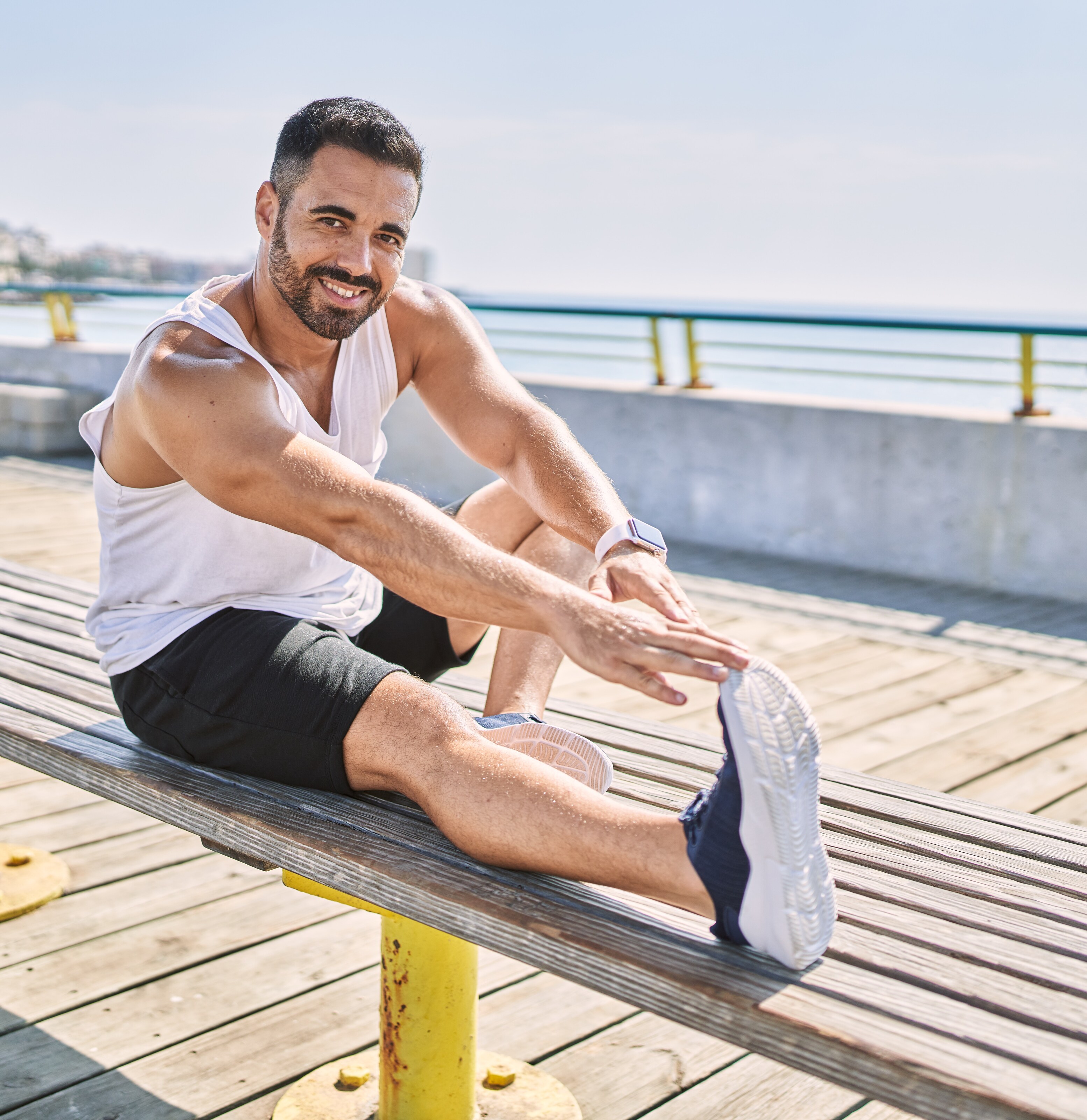 A man stretches on a bench, promoting fitness at Brij Medical Centre.