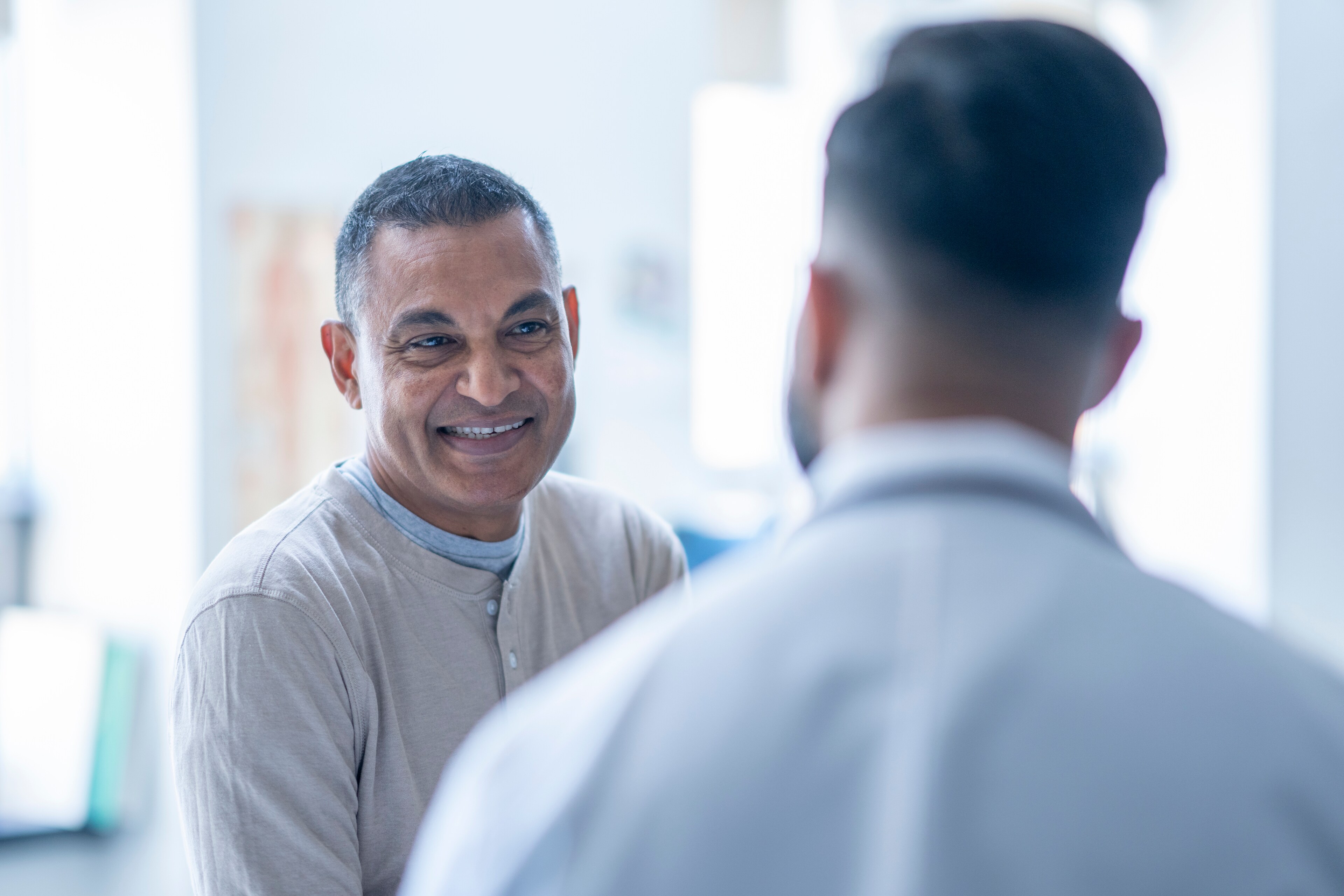 A patient smiles while consulting at Brij Medical Centre, UP.