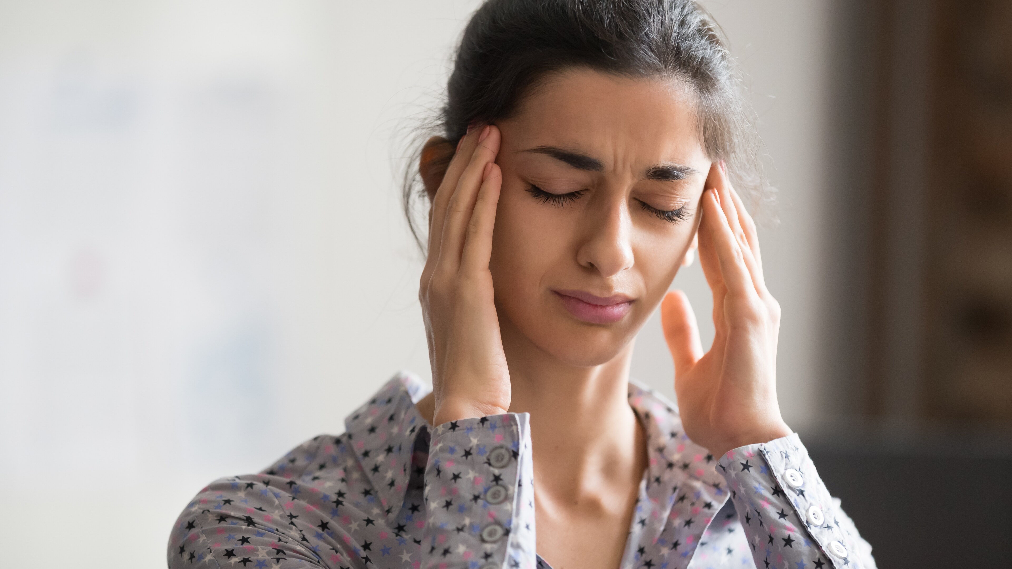 A woman experiences a headache at Brij Medical Centre in Kavi Nagar.
