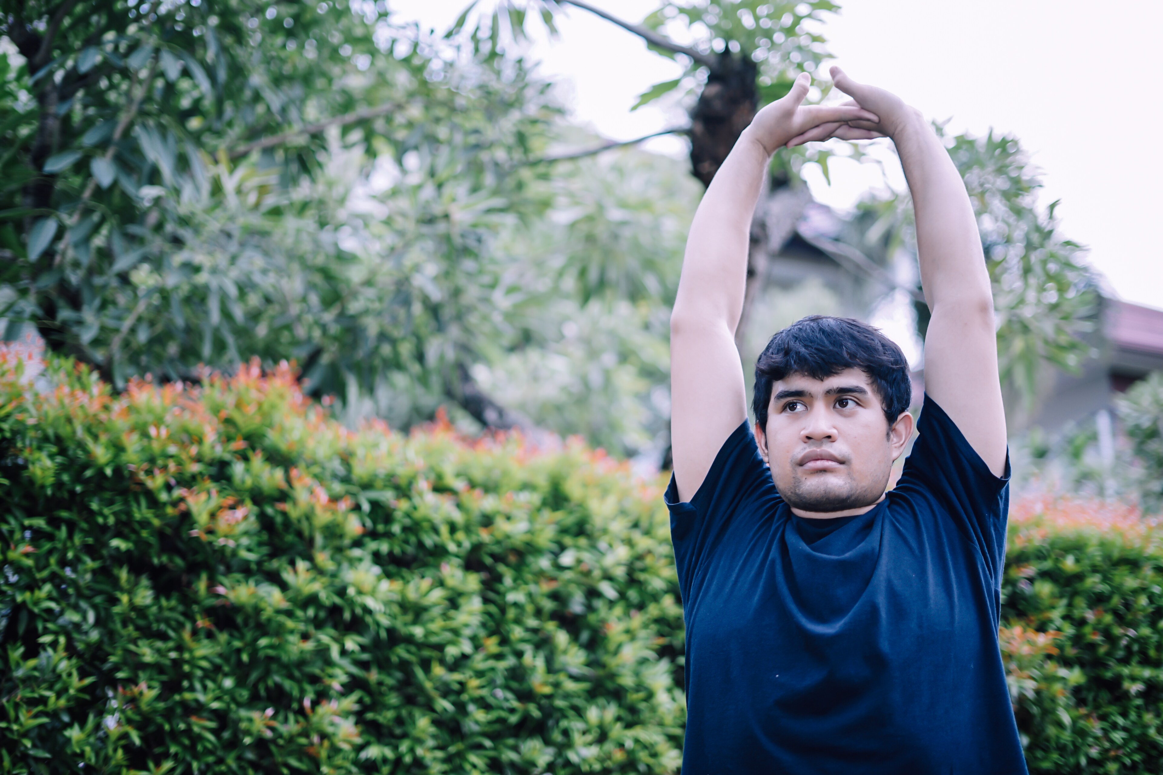 A young man stretches outdoors at Brij Medical Centre in Kavi Nagar.