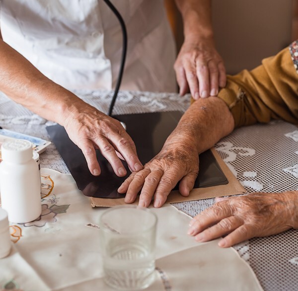 Senior woman arm pain evaluation