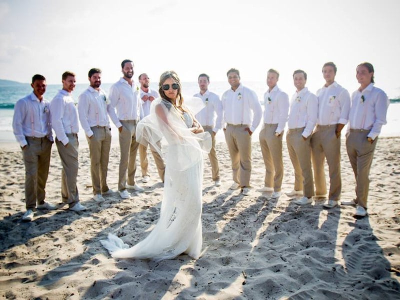 Bride with groomsmen on the beach at Margaritaville Playa Flamingo