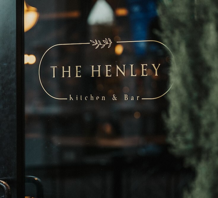 A gourmet dish featuring tender cuts of meat, quail eggs, and crispy garnishes, artfully presented at The Henley in Southlake, TX.