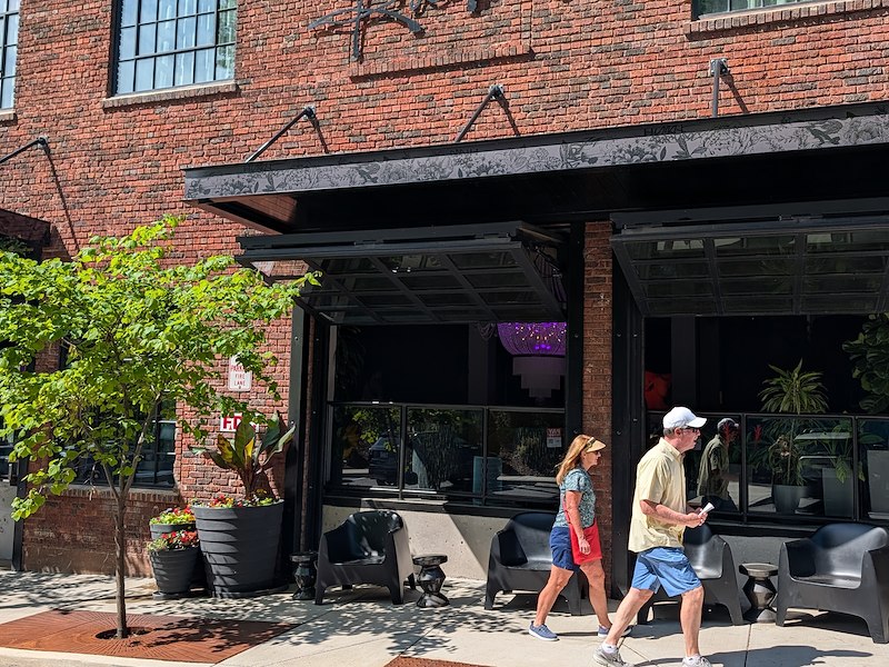 People walking outside The Radical