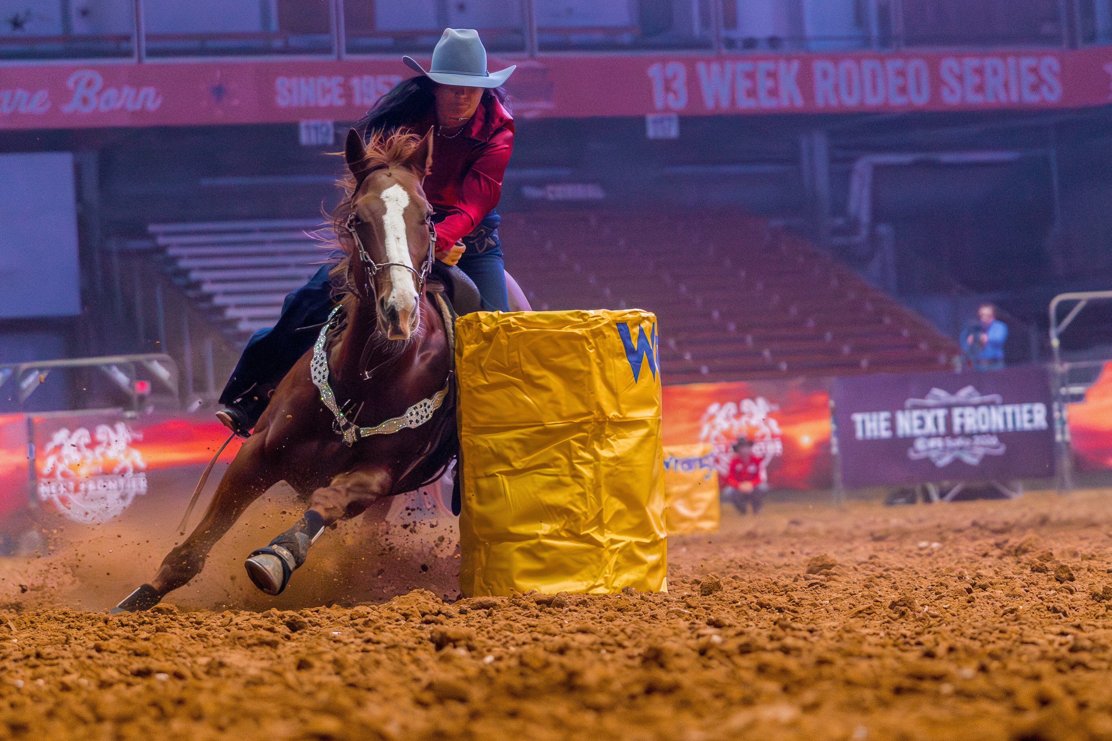 A man riding a horse in a rodeo