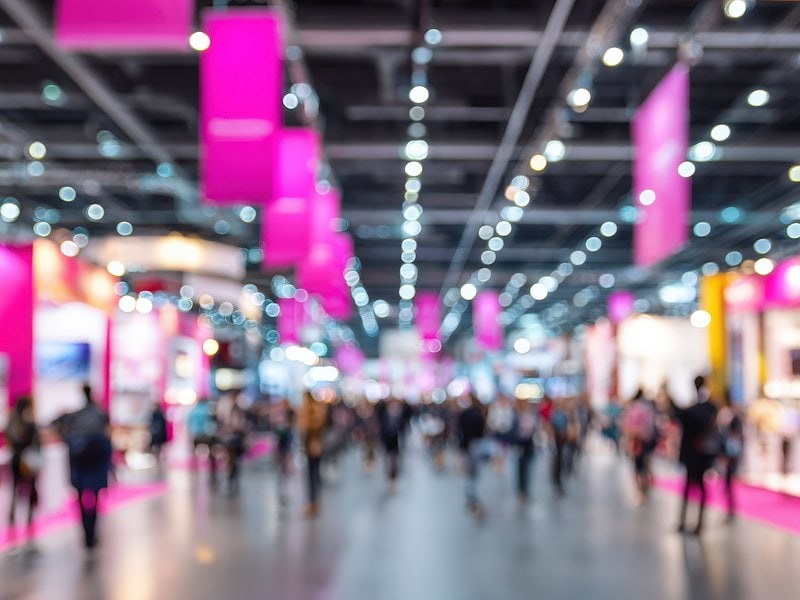 Blurred view of a bustling exhibition hall