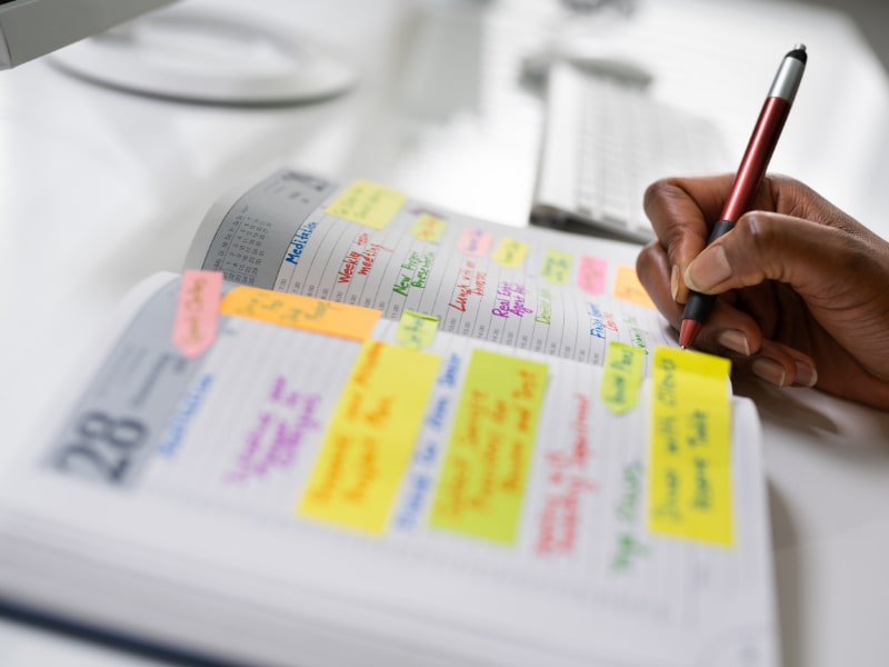 A person writing in a diary