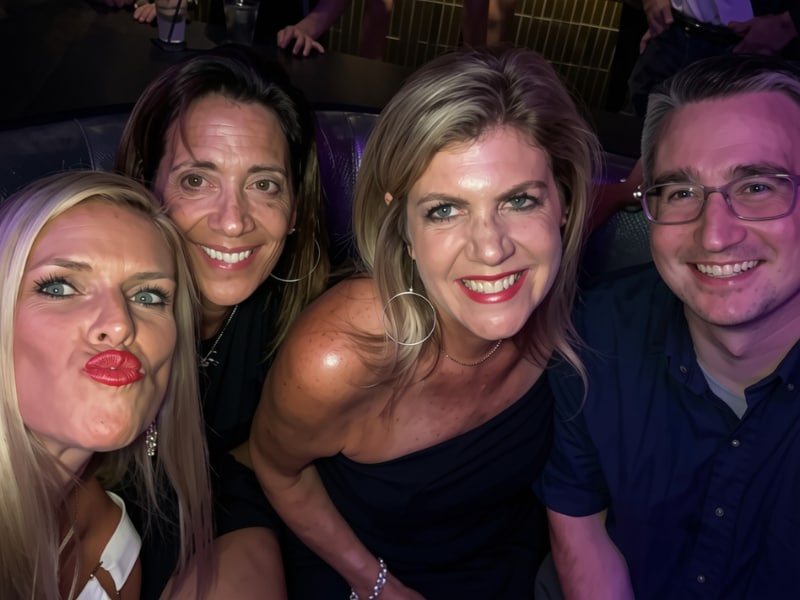 A group of people posing for a selfie