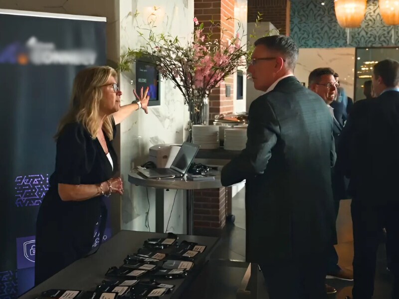 Event check-in staff assists at registration table