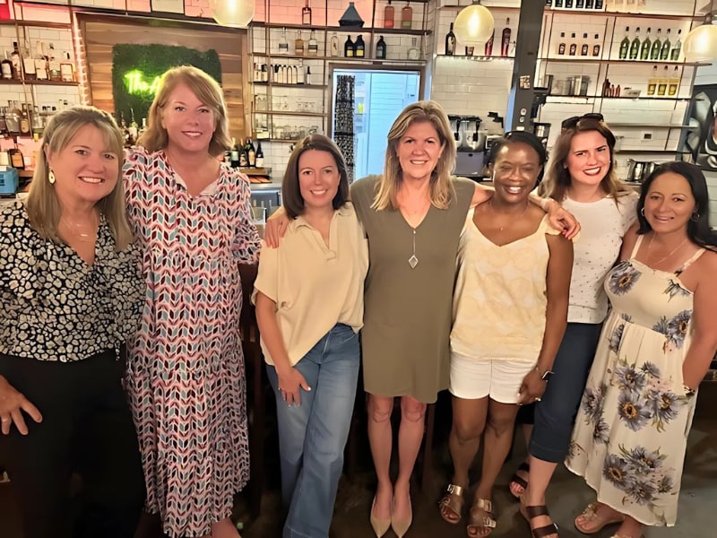 A group of women posing for a photo