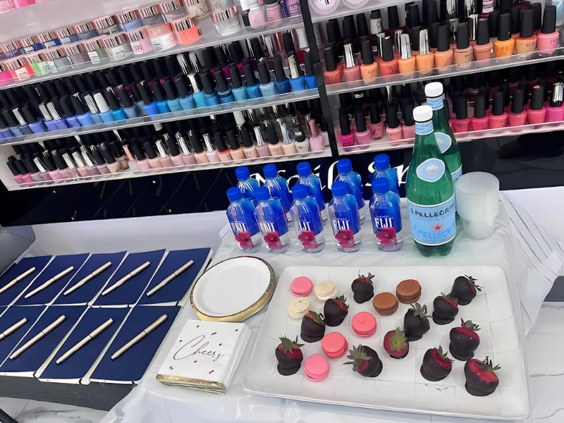 A table with food and bottles of nail polish