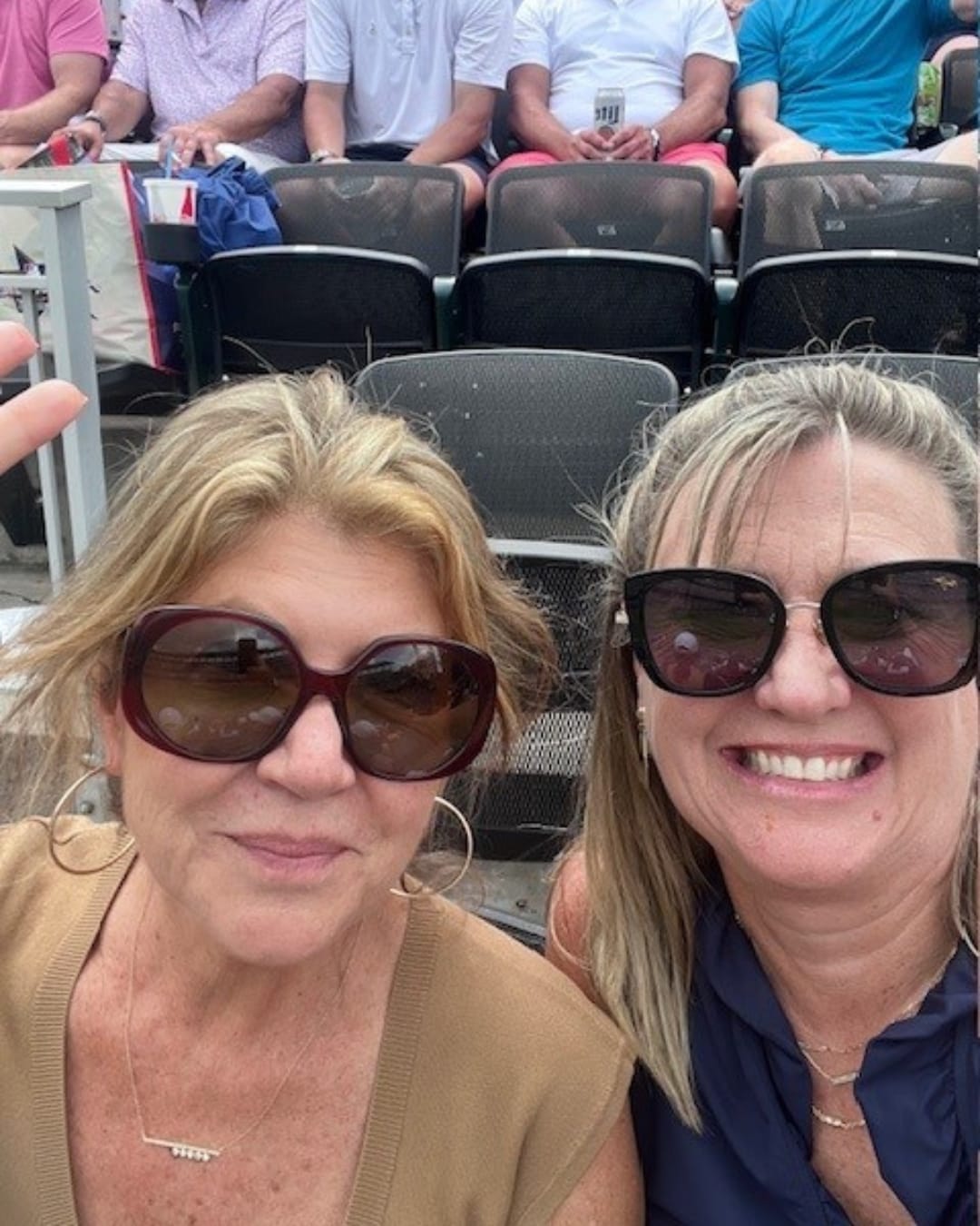 A group of women wearing sunglasses