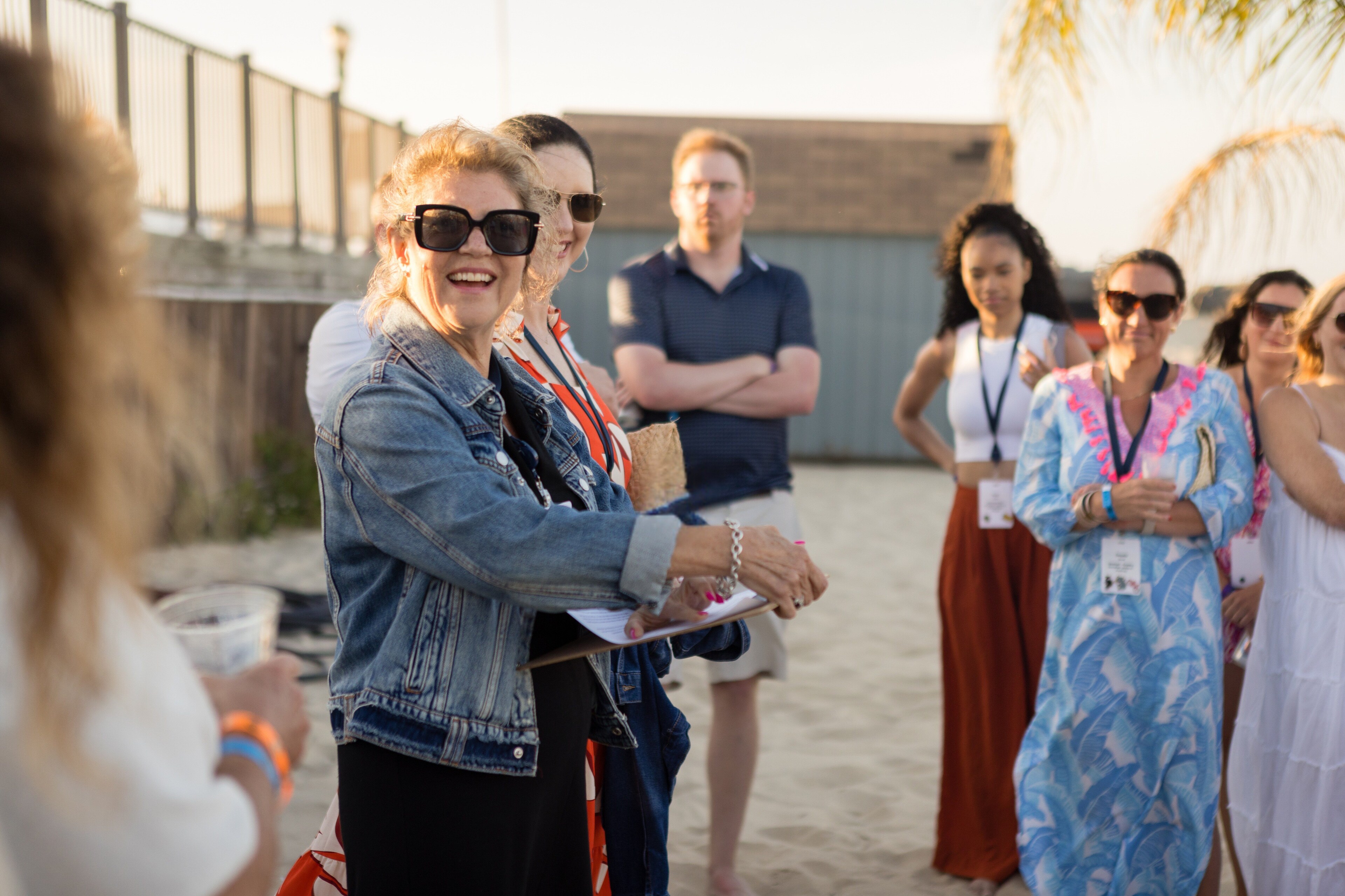 A group of people standing on a beach