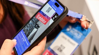 Event tech scanning a badge for lead capture by EMC Meeting & Events, Sea Girt, New Jersey