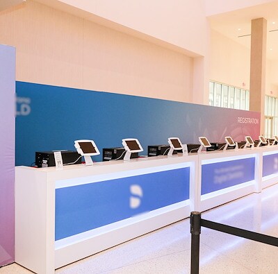 Registration Desk set-up with check-in kiosks by EMC Meeting & Events, Sea Girt, New Jersey