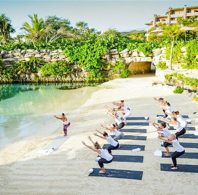 Group morning yoga session for an incentive group in Mexico by EMC Meeting & Events, Sea Girt, New Jersey