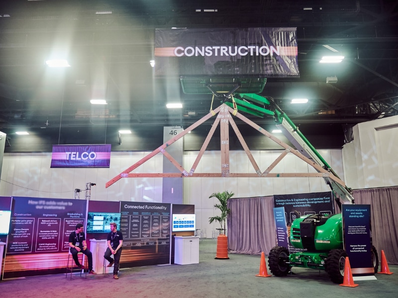Tradeshow floor with a construction-themed booth.